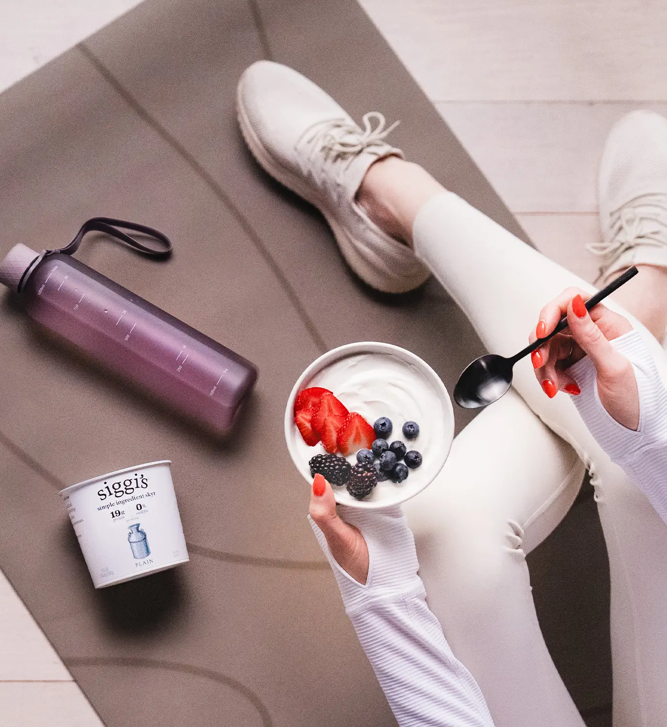 athlete on yoga mat with siggi's yogurt