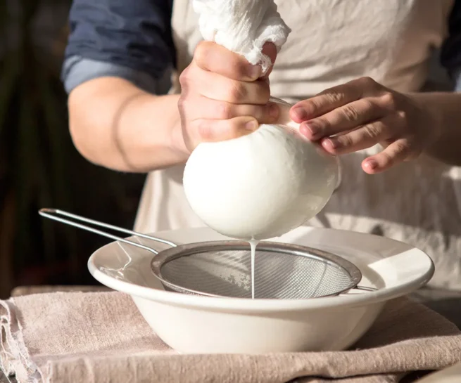 straining milk to make skyr